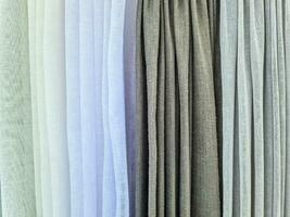 Close up view on samples of cloth and fabrics in different colors. photo