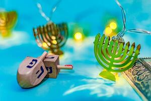 Close up of dreidel and menorah yellow Hanukkah. photo