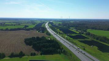 Aerial view on the A7 motorway in northern Germany between fields and meadows. photo