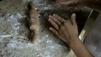 Girl of 6 years old is preparing dough for a pizza video