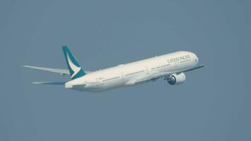 HONG KONG NOVEMBER 09, 2019 - Aircraft Boeing 777 of Cathay Pacific taking off and climbing at Hong Kong airport. Passenger flight departure, side view. Airplane in the sky. video