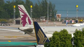 PHUKET, THAILAND FEBRUARY 26, 2023 - Airbus A320 of IndiGo on the airfield, taxiing to the terminal. Airplane Indian Airlines arrival in Phuket video