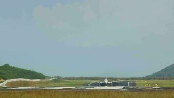 Shot of an airplane taking off, long shot. Flight departure. Haze on the airfield, hot summer day video