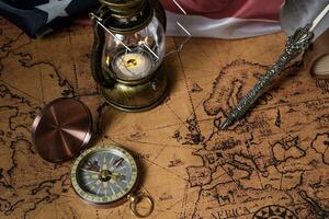 Columbus Day. Vintage world map and discovery equipment. photo