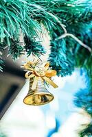 Little golden bell for Christmas decorations. photo