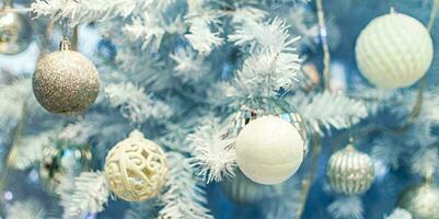 Close up of Christmas tree with white ornaments. photo