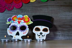 Sugar skulls with candle on Day of the Dead festival in Mexico. photo