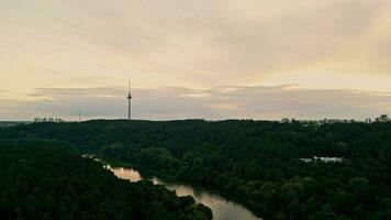 The drone takes off over the park. View of the city and the TV tower video