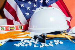 American flag and tools near the helmet labor day concept. photo