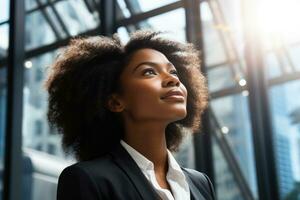 Successful black businesswoman standing in modern city envisioning new opportunities photo