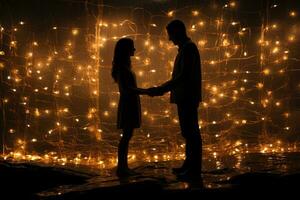 Two individuals facing each other holding hands with lights on photo