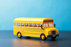 Transportation and education concept yellow school bus model on chalkboard photo