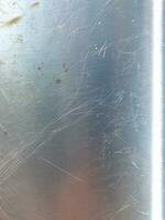 Metal texture with dust scratches and cracks. photo