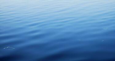 Blue water surface background photo