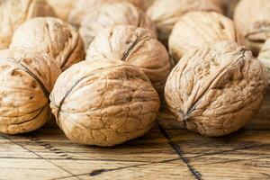 Walnuts on dark vintage wooden background. Walnut healthy food photo