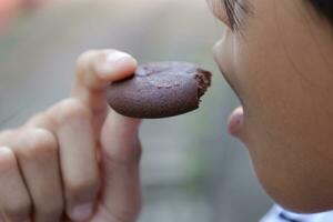 Close-up view of mouth eating food photo