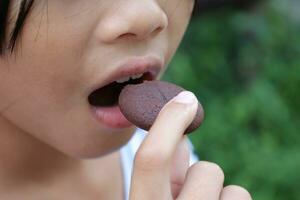 Close-up view of mouth eating food photo