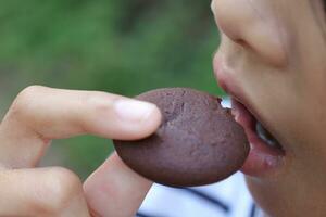 Close-up view of mouth eating food photo