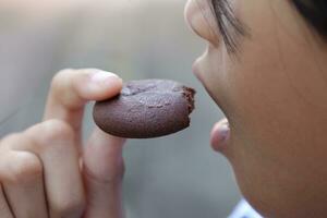 Close-up view of mouth eating food photo