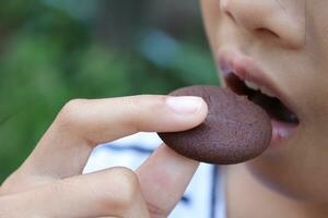 Close-up view of mouth eating food photo