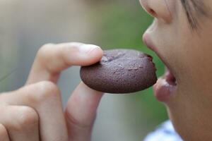 Close-up view of mouth eating food photo