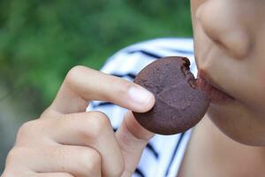 Close-up view of mouth eating food photo