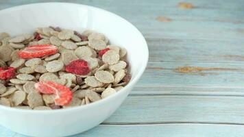 A bowl of toasted wheat cereal with freeze dried strawberries video