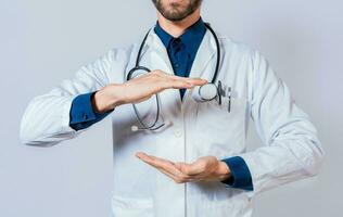 Unrecognizable doctor holding empty hands isolated. Doctor hands presenting something empty handed. Doctor holding something in his hands isolated photo