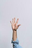 Hand counting number five, Man hand showing number five, Guy finger counting number five on isolated background photo