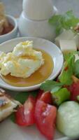 butter cream and honey in a bowl on table . video