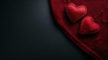 two red knitted hearts photo