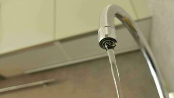 low angle view of water pouring from a faucet tap video