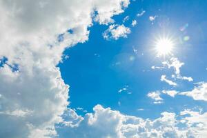 Blue sky with white clouds and sun Beautiful natural background photo