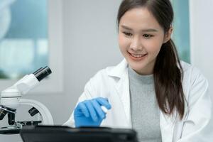 Scientist analyze biochemical samples in advanced scientific laboratory. Medical professional use microscope look microbiological developmental of viral. Biotechnology research in science lab. photo
