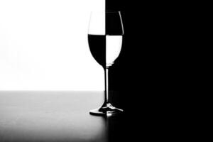 a glass of water and smoke on a black and white background photo