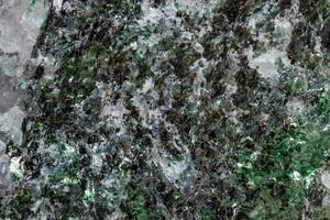 Macro mineral stone Fuchsite on a white background photo