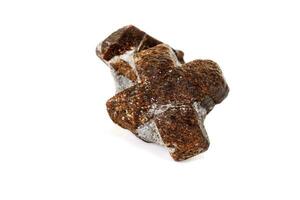 macro mineral stone Staurolite on a white background photo