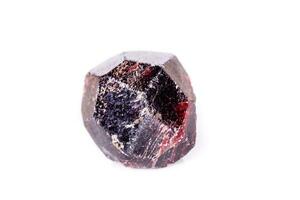 Macro of a mineral garnet stone on a white background photo