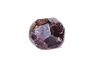 Macro of a mineral garnet stone on a white background photo