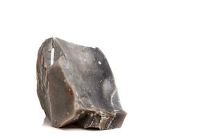 Macro mineral stone Flint in the rock on a white background photo