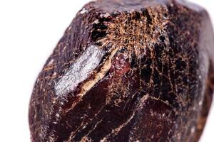 Macro of a mineral garnet stone on a white background photo