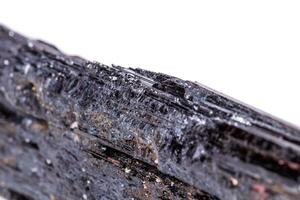 macro mineral stone sherle, schorl, black tourmaline on white background photo