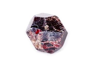 Macro of a mineral garnet stone on a white background photo