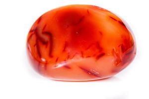 Macro mineral stone Carnelian on white background photo