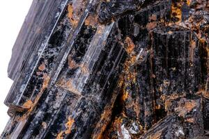 macro mineral stone sherle, schorl, black tourmaline on white background photo