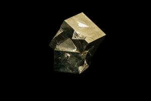 Macro mineral stone Pyrite on a black background photo