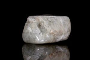 Macro mineral stone Moonstone on black background photo