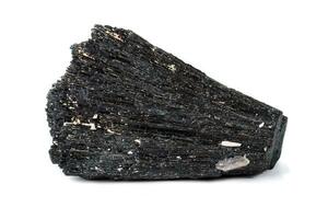 Macro mineral stone Schorl, Black Tourmaline on a white background photo