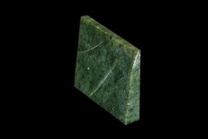 Nephrite mineral stone macro on a black background photo