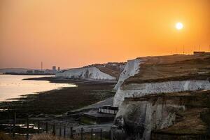 Evening on a walk by the cliffs with a low hanging sun photo